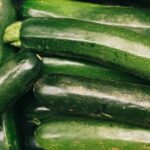A detailed close-up of fresh green zucchini showcasing their organic quality and nutrition.